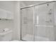 Updated shower with glass doors and tiled walls at 2471 Dubai St, Kissimmee, FL 34747