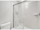 Contemporary shower stall featuring sliding glass doors and tiled walls at 2471 Dubai St, Kissimmee, FL 34747