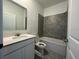 Bathroom with a white vanity, neutral countertops, shower and bath combination at 250 Brave Rd, Davenport, FL 33837