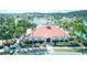 Beautiful aerial view of the community clubhouse, pool, and surrounding lush landscaping at 2512 Volta Cir, Kissimmee, FL 34746