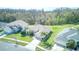 A high-angle shot of a well-maintained home, showcasing its landscaping and proximity to a tranquil pond at 2512 Volta Cir, Kissimmee, FL 34746