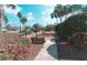 Inviting community playground with mature landscaping, bench, and play equipment provides a safe and fun environment for children at 2512 Volta Cir, Kissimmee, FL 34746