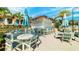 Outdoor poolside bar featuring seating with umbrellas, perfect for relaxing and enjoying refreshments at 2536 Shanti Dr, Kissimmee, FL 34746