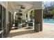 Relaxing poolside seating area with ceiling fans and view of the swimming pool at 2536 Shanti Dr, Kissimmee, FL 34746