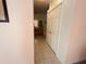 View of the bathroom hallway with access to the vanity and toilet/shower rooms at 2577 Aster Cove Ln, Kissimmee, FL 34758