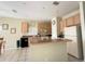 Well-lit kitchen with black appliances and tile flooring at 2577 Aster Cove Ln, Kissimmee, FL 34758