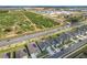 A high aerial view shows new construction homes next to a highway and a green field with trees at 281 Piave St, Haines City, FL 33844