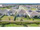 Aerial view of a well-maintained backyard featuring a covered patio and green lawn at 281 Piave St, Haines City, FL 33844