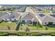 An aerial view of a well-maintained backyard featuring a covered patio and green lawn at 281 Piave St, Haines City, FL 33844