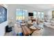 Elegant dining room featuring a large wooden table and sliding glass doors to the lanai at 281 Piave St, Haines City, FL 33844