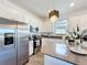 Modern kitchen featuring stainless steel appliances, ample counter space and stylish decor at 281 Piave St, Haines City, FL 33844