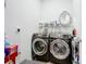 The laundry room features front load gray washer and dryer at 281 Piave St, Haines City, FL 33844