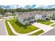 An aerial view of a well-manicured home and lawn located in a quiet residential neighborhood at 31792 Broadwater Ave, Leesburg, FL 34748