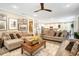 Open-concept living room flows into the kitchen, features tile floors and neutral tones at 31792 Broadwater Ave, Leesburg, FL 34748