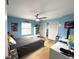 Bright bedroom with hardwood floors, ceiling fan, and natural light from the window at 3285 Majestic Oak Dr, St Cloud, FL 34771