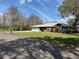 Beautiful home surrounded by mature trees, featuring an attached two-car garage and a spacious front yard at 3285 Majestic Oak Dr, St Cloud, FL 34771