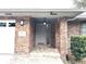 Inviting brick front entrance with a gray front door and stylish overhead lighting at 3285 Majestic Oak Dr, St Cloud, FL 34771