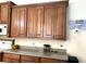 Kitchen featuring wooden cabinets, granite countertops, and stainless steel appliances at 3285 Majestic Oak Dr, St Cloud, FL 34771