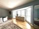 Bright and airy living room with hardwood floors, a bay window, and stylish furniture at 3285 Majestic Oak Dr, St Cloud, FL 34771