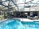 Relaxing pool area with ample lounge seating and patio furniture for outdoor enjoyment at 3285 Majestic Oak Dr, St Cloud, FL 34771