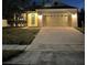 Charming one-story home featuring a two-car garage and well-maintained lawn at 3470 Goldeneye Ln, St Cloud, FL 34772