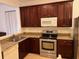 Kitchen boasting sleek stainless steel appliances and granite countertops at 3470 Goldeneye Ln, St Cloud, FL 34772