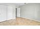 Neutral bedroom features closet and doorway, with tile floors and neutral walls at 3723 Isles Arbor Ln, Kissimmee, FL 34746