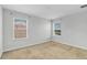 Bedroom with neutral carpet and two windows offering natural light and a view at 3723 Isles Arbor Ln, Kissimmee, FL 34746