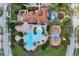 Aerial of the community pool and playground showcasing lush landscaping and surrounding homes at 3723 Isles Arbor Ln, Kissimmee, FL 34746