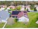 Aerial view of a single story home featuring solar panels and lush green lawn at 4119 Maidu Ct, St Cloud, FL 34772