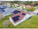 Aerial view of a single story home featuring solar panels and well maintained lawn at 4119 Maidu Ct, St Cloud, FL 34772