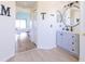 Bathroom view to the bedroom with updated vanity with undermount sink and tile floors at 4119 Maidu Ct, St Cloud, FL 34772