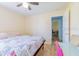 Comfortable bedroom with wood floor, ceiling fan and a nice sized closet at 4119 Maidu Ct, St Cloud, FL 34772