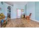 Bright and airy entryway featuring wood look floors and light turquoise walls at 4119 Maidu Ct, St Cloud, FL 34772