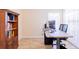 Bright office with a wooden desk, bookshelf, and wood flooring at 4119 Maidu Ct, St Cloud, FL 34772