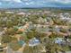 Aerial view showcases the home nestled among trees, close to community amenities and city center at 4318 Oak Ct, St Cloud, FL 34769