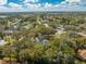 Neighborhood aerial view showing the home nestled among lush trees and community surroundings at 4318 Oak Ct, St Cloud, FL 34769