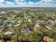 Aerial view of a home in a residential neighborhood surrounded by mature trees and green spaces at 4318 Oak Ct, St Cloud, FL 34769