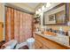 Traditional bathroom with a copper sink, granite counter, and framed mirror at 4318 Oak Ct, St Cloud, FL 34769