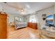 Cozy bedroom with laminate flooring, ceiling fan, and natural light at 4318 Oak Ct, St Cloud, FL 34769