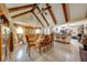 Spacious dining room with high ceilings and exposed wooden beams that seamlessly connects to the kitchen, perfect for entertaining at 4318 Oak Ct, St Cloud, FL 34769