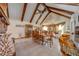 Spacious dining area featuring vaulted ceilings, wooden beams, and seamless flow to the kitchen, creating an inviting space at 4318 Oak Ct, St Cloud, FL 34769