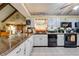 Well-equipped kitchen with a view to the dining area, featuring granite countertops at 4318 Oak Ct, St Cloud, FL 34769