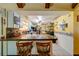 Bright kitchen view with a granite counter peninsula offering seating, connecting to a dining area, and enhancing open concept design at 4318 Oak Ct, St Cloud, FL 34769