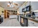 Well-lit kitchen with white cabinets, tiled floor, and modern appliances at 4318 Oak Ct, St Cloud, FL 34769