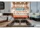 Close-up of the kitchen sink with rooster patterned curtains, granite countertops, and a small window, adding charm to the workspace at 4318 Oak Ct, St Cloud, FL 34769