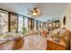 A sun room featuring windows, tiled floors, and ceiling fans at 4318 Oak Ct, St Cloud, FL 34769