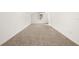 Expansive room featuring neutral carpet, natural light, and white walls at 4815 Cypress Dr, Lake Wales, FL 33898