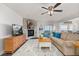 Cozy living room featuring a stone fireplace, comfortable seating, and an inviting atmosphere at 4815 Cypress Dr, Lake Wales, FL 33898