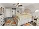 Comfortable main bedroom with decorative rug and view to the main bath at 4815 Cypress Dr, Lake Wales, FL 33898